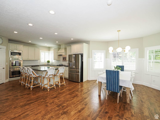 618 E Beaumont Way S, Draper, UT 84020 - dining space featuring a chandelier, dark wood-style floors, a wainscoted wall, recessed lighting, and healthy amount of natural light