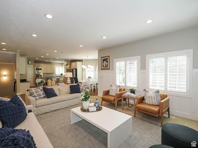 618 E Beaumont Way S, Draper, UT 84020 - living area with a decorative wall, recessed lighting, wainscoting, and a chandelier