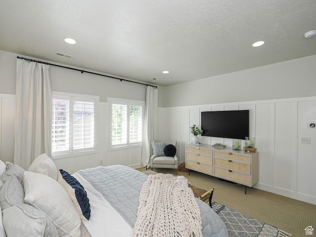 618 E Beaumont Way S, Draper, UT 84020 - carpeted bedroom featuring a decorative wall, wainscoting, recessed lighting, and a textured ceiling