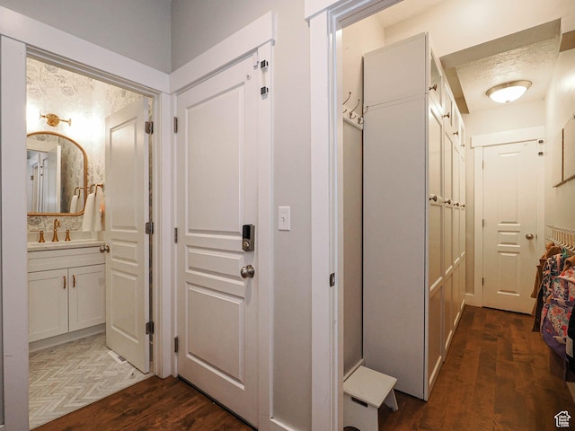 618 E Beaumont Way S, Draper, UT 84020 - hallway with dark wood-type flooring and a sink