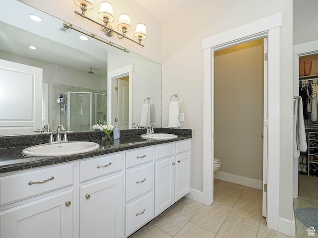618 E Beaumont Way S, Draper, UT 84020 - bathroom with a stall shower, a spacious closet, double vanity, recessed lighting, and marble look tiles