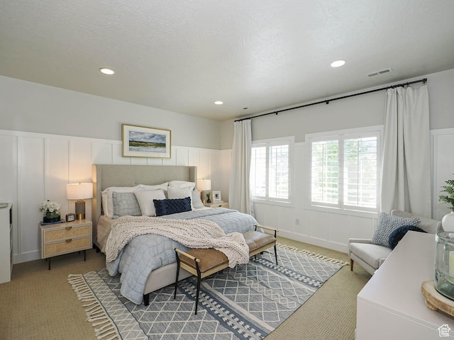 618 E Beaumont Way S, Draper, UT 84020 - bedroom with light carpet, a decorative wall, wainscoting, and recessed lighting