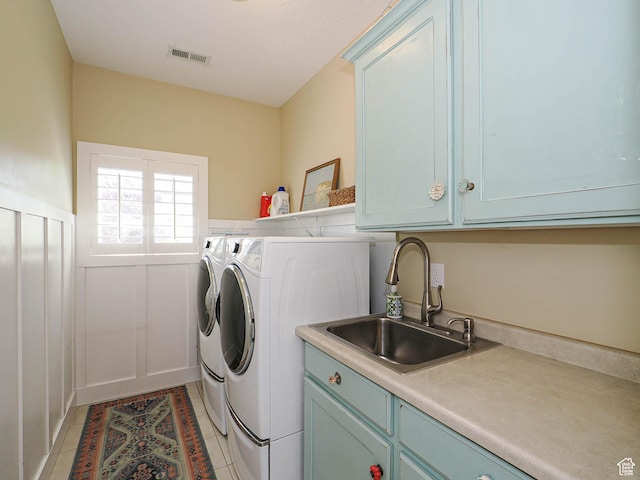 618 E Beaumont Way S, Draper, UT 84020 - laundry area with cabinet space, washer and dryer, light tile patterned floors, and wainscoting