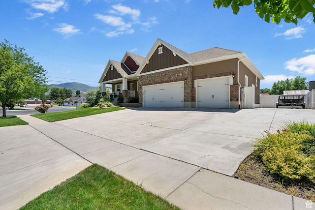 809 W 1320 N, West Bountiful, UT 84087 - craftsman-style home with a garage, concrete driveway, stone siding, a gate, and board and batten siding