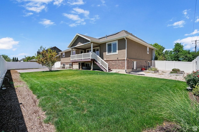 809 W 1320 N, West Bountiful, UT 84087 - rear view of property with a fenced backyard, brick siding, stucco siding, stairs, and solar panels
