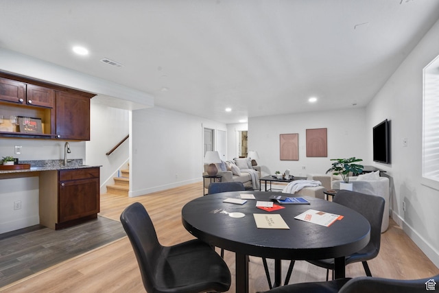 809 W 1320 N, West Bountiful, UT 84087 - dining space with recessed lighting, light wood finished floors, wet bar, and stairway