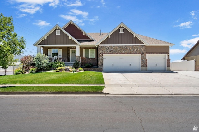 809 W 1320 N, West Bountiful, UT 84087 - craftsman-style house with a garage, driveway, board and batten siding, and a porch