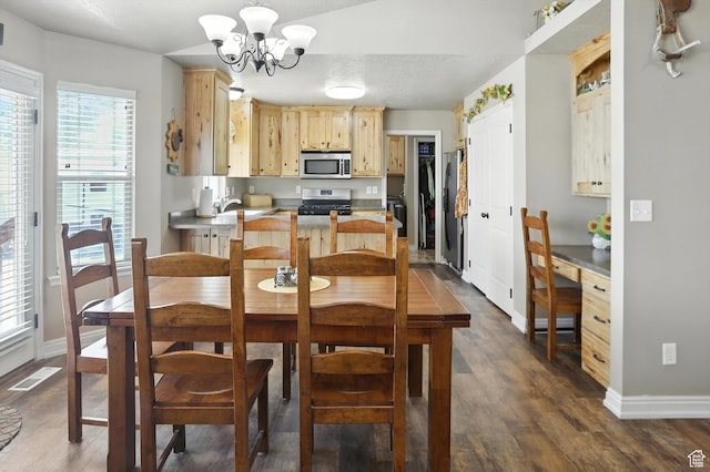 758 N 400 E, Tremonton, UT 84337 - dining space featuring a chandelier and dark wood-style flooring