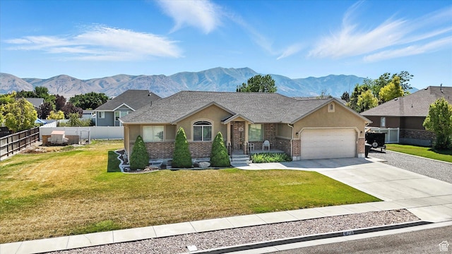 758 N 400 E, Tremonton, UT 84337 - ranch-style house with brick siding, a garage, and a mountain view