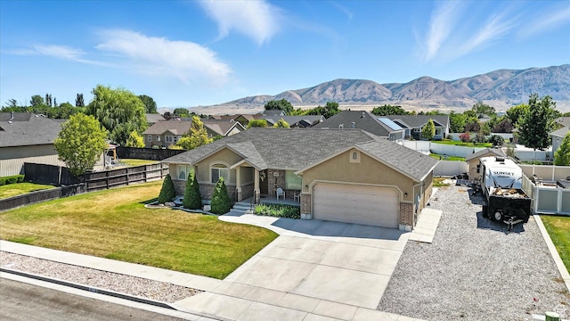 758 N 400 E, Tremonton, UT 84337 - view of front of home with a residential view, an attached garage, driveway, and stucco siding