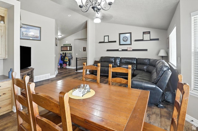 758 N 400 E, Tremonton, UT 84337 - dining room featuring dark wood finished floors, vaulted ceiling, and a chandelier