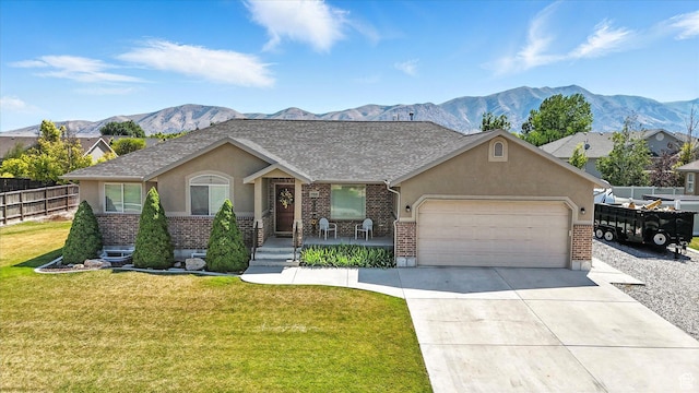 758 N 400 E, Tremonton, UT 84337 - view of front facade featuring brick siding, an attached garage, stucco siding, and driveway
