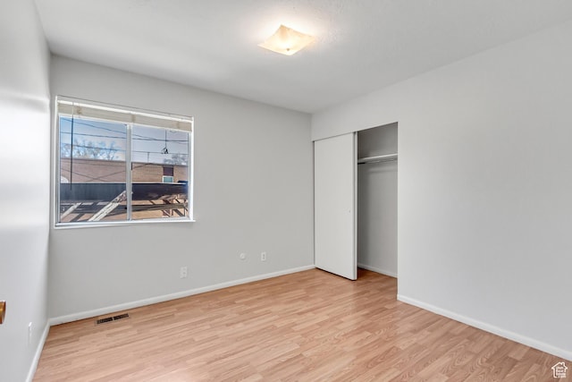 1030 Healy St Unit 2, Ogden, UT 84403 - unfurnished bedroom with wood finished floors and a closet
