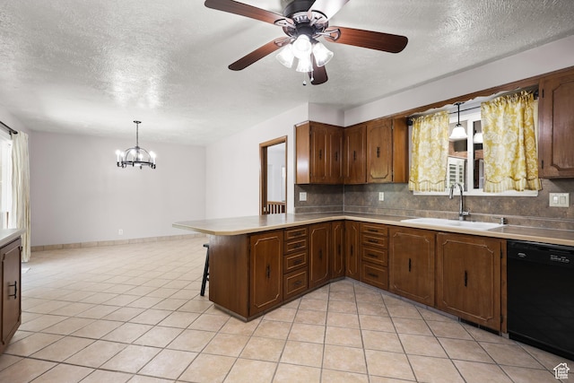 1657 E 1500 N, Logan, UT 84341 - kitchen with dishwasher, a textured ceiling, a peninsula, decorative backsplash, and a chandelier
