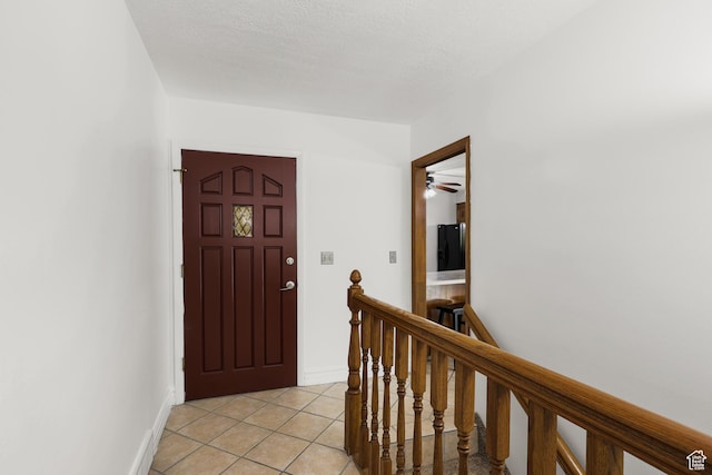1657 E 1500 N, Logan, UT 84341 - foyer entrance with light tile patterned floors and a ceiling fan