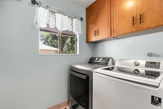 1657 E 1500 N, Logan, UT 84341 - washroom featuring cabinet space and washer and dryer
