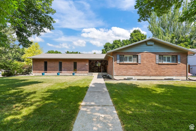 1657 E 1500 N, Logan, UT 84341 - ranch-style house featuring brick siding and a front lawn