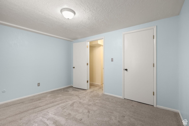 1657 E 1500 N, Logan, UT 84341 - unfurnished bedroom featuring carpet floors and a textured ceiling