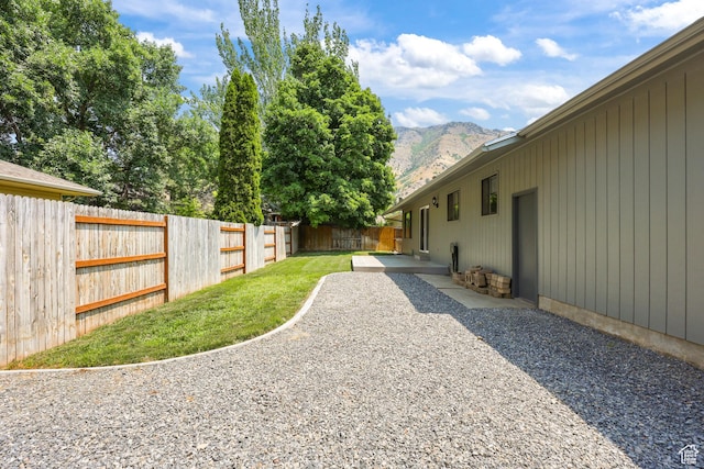 1657 E 1500 N, Logan, UT 84341 - fenced backyard with a mountain view and a patio