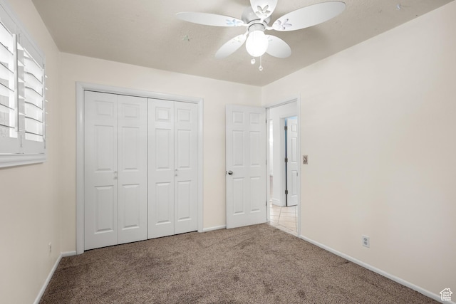 1657 E 1500 N, Logan, UT 84341 - unfurnished bedroom with carpet, a closet, and ceiling fan
