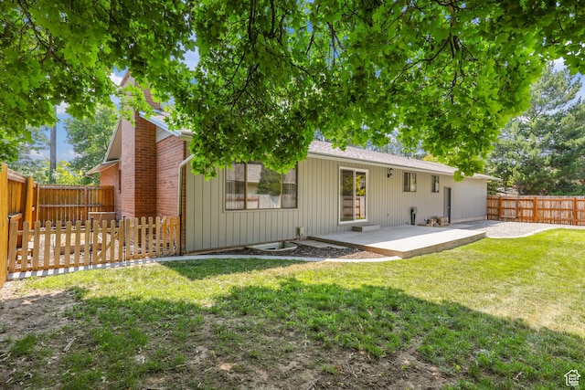 1657 E 1500 N, Logan, UT 84341 - back of house with a patio area, a fenced backyard, and a chimney