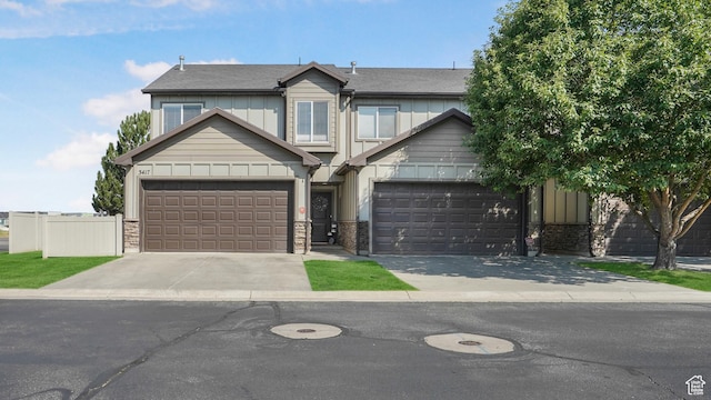 3417 S Kenna Ln Unit 1, West Haven, UT 84401 - view of front facade with driveway, board and batten siding, and stone siding