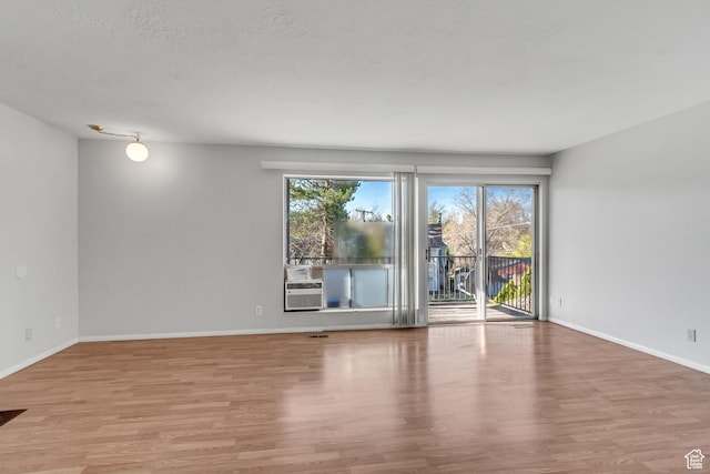 1050 Healy St Unit 1, Ogden, UT 84403 - empty room with wood finished floors and cooling unit