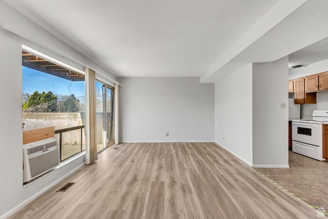 1050 Healy St Unit 1, Ogden, UT 84403 - unfurnished living room featuring light wood-type flooring and cooling unit