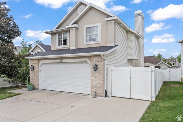 573 E Compass Cir S, North Salt Lake, UT 84054 - view of front of home with an attached garage, a gate, driveway, a chimney, and brick siding