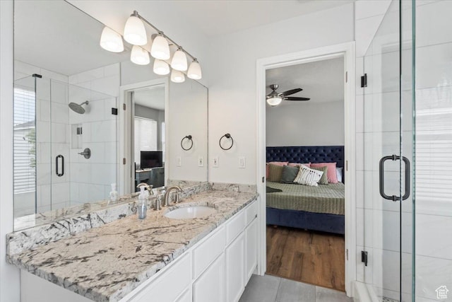 573 E Compass Cir S, North Salt Lake, UT 84054 - bathroom with connected bathroom, a shower stall, vanity, and a ceiling fan