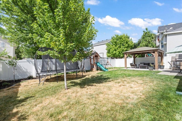 573 E Compass Cir S, North Salt Lake, UT 84054 - fenced backyard featuring a trampoline, a gazebo, a playground, and a patio