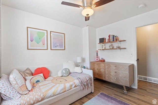 573 E Compass Cir S, North Salt Lake, UT 84054 - bedroom featuring wood finished floors and a ceiling fan