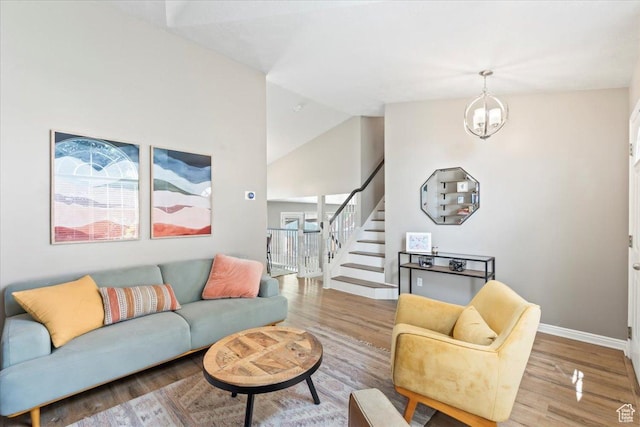 573 E Compass Cir S, North Salt Lake, UT 84054 - living area with stairs, wood finished floors, and vaulted ceiling