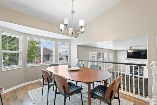 573 E Compass Cir S, North Salt Lake, UT 84054 - dining area featuring a chandelier, wood finished floors, plenty of natural light, and lofted ceiling