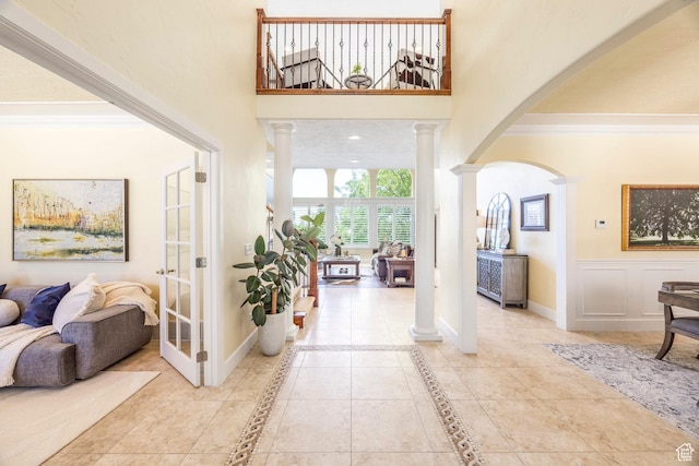 897 W Pfeifferhorn Dr, Alpine, UT 84004 - foyer with decorative columns, arched walkways, and crown molding