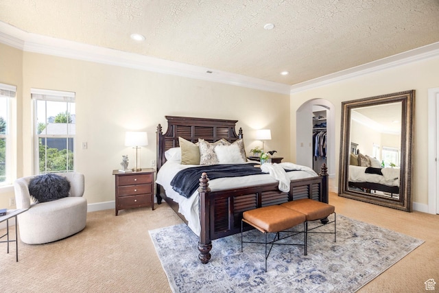 897 W Pfeifferhorn Dr, Alpine, UT 84004 - bedroom with light colored carpet, a textured ceiling, ornamental molding, a spacious closet, and arched walkways