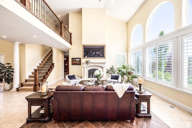 897 W Pfeifferhorn Dr, Alpine, UT 84004 - living room featuring high vaulted ceiling, stairway, a fireplace, decorative columns, and recessed lighting