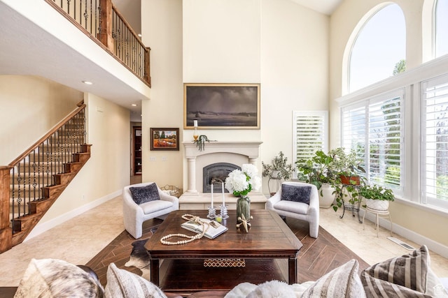 897 W Pfeifferhorn Dr, Alpine, UT 84004 - living room with a towering ceiling, stairway, and a fireplace with raised hearth