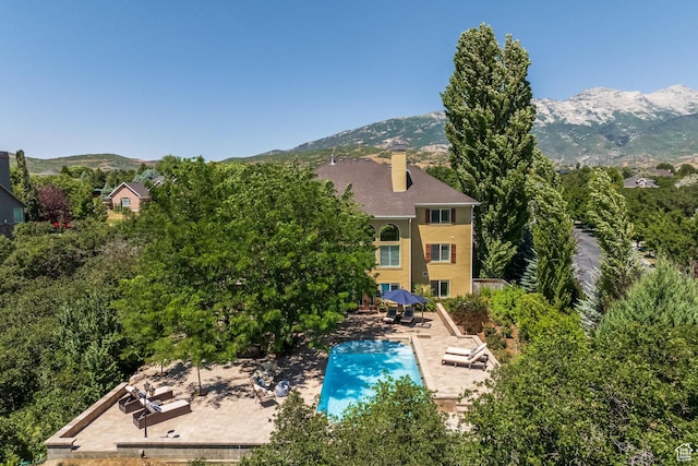 897 W Pfeifferhorn Dr, Alpine, UT 84004 - rear view of property with a chimney, a patio area, and a mountain view