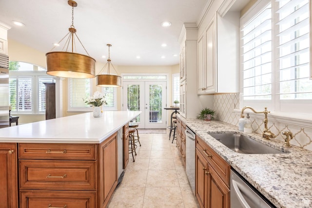 897 W Pfeifferhorn Dr, Alpine, UT 84004 - kitchen with french doors, brown cabinets, stainless steel dishwasher, decorative backsplash, and recessed lighting