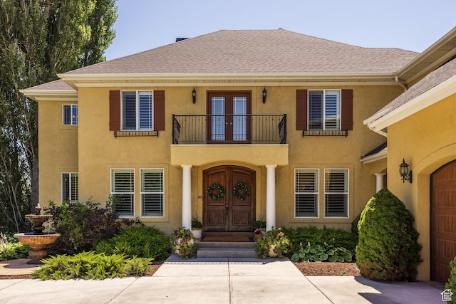 897 W Pfeifferhorn Dr, Alpine, UT 84004 - doorway to property with a balcony, french doors, stucco siding, and a shingled roof
