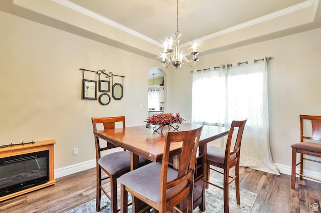 483 W 3500 N, Pleasant View, UT 84414 - dining space featuring arched walkways, ornamental molding, wood-type flooring, and a chandelier