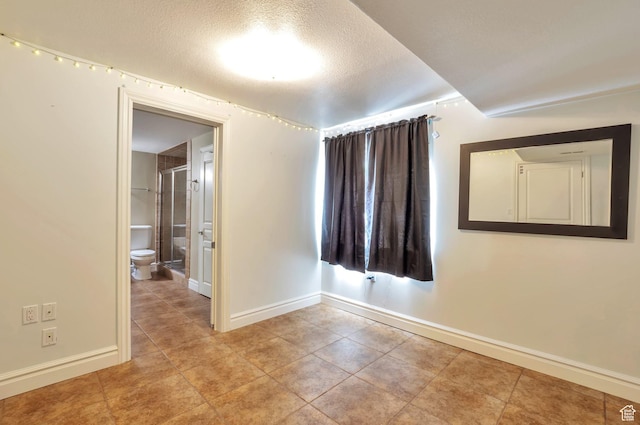 483 W 3500 N, Pleasant View, UT 84414 - tiled empty room with baseboards and a textured ceiling