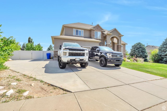 483 W 3500 N, Pleasant View, UT 84414 - traditional-style house featuring concrete driveway, stucco siding, and stone siding