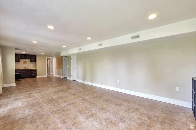 483 W 3500 N, Pleasant View, UT 84414 - unfurnished living room featuring recessed lighting and a textured ceiling