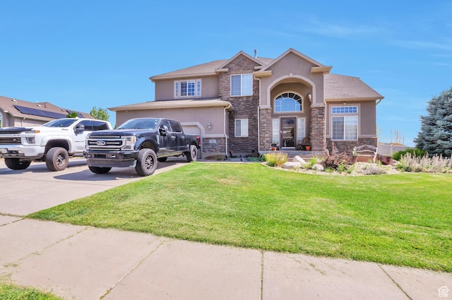 483 W 3500 N, Pleasant View, UT 84414 - view of front of home with stucco siding, stone siding, concrete driveway, and a front yard