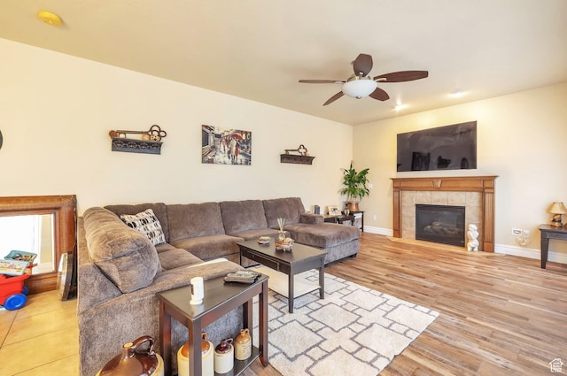 483 W 3500 N, Pleasant View, UT 84414 - living room with ceiling fan, wood finished floors, and a tiled fireplace