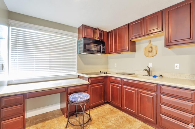483 W 3500 N, Pleasant View, UT 84414 - kitchen featuring black appliances, reddish brown cabinets, built in desk, light countertops, and light tile patterned floors