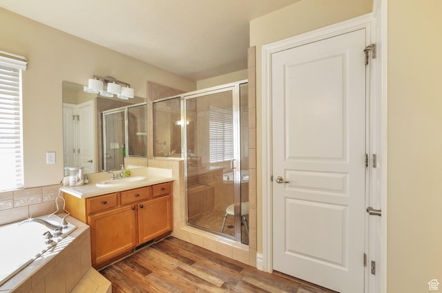 483 W 3500 N, Pleasant View, UT 84414 - bathroom with vanity, a stall shower, a garden tub, and plenty of natural light