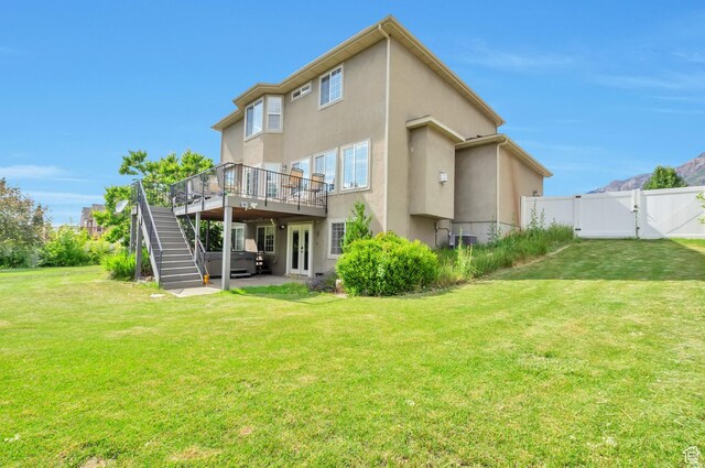 483 W 3500 N, Pleasant View, UT 84414 - rear view of house featuring a gate, stucco siding, a deck, stairs, and a patio
